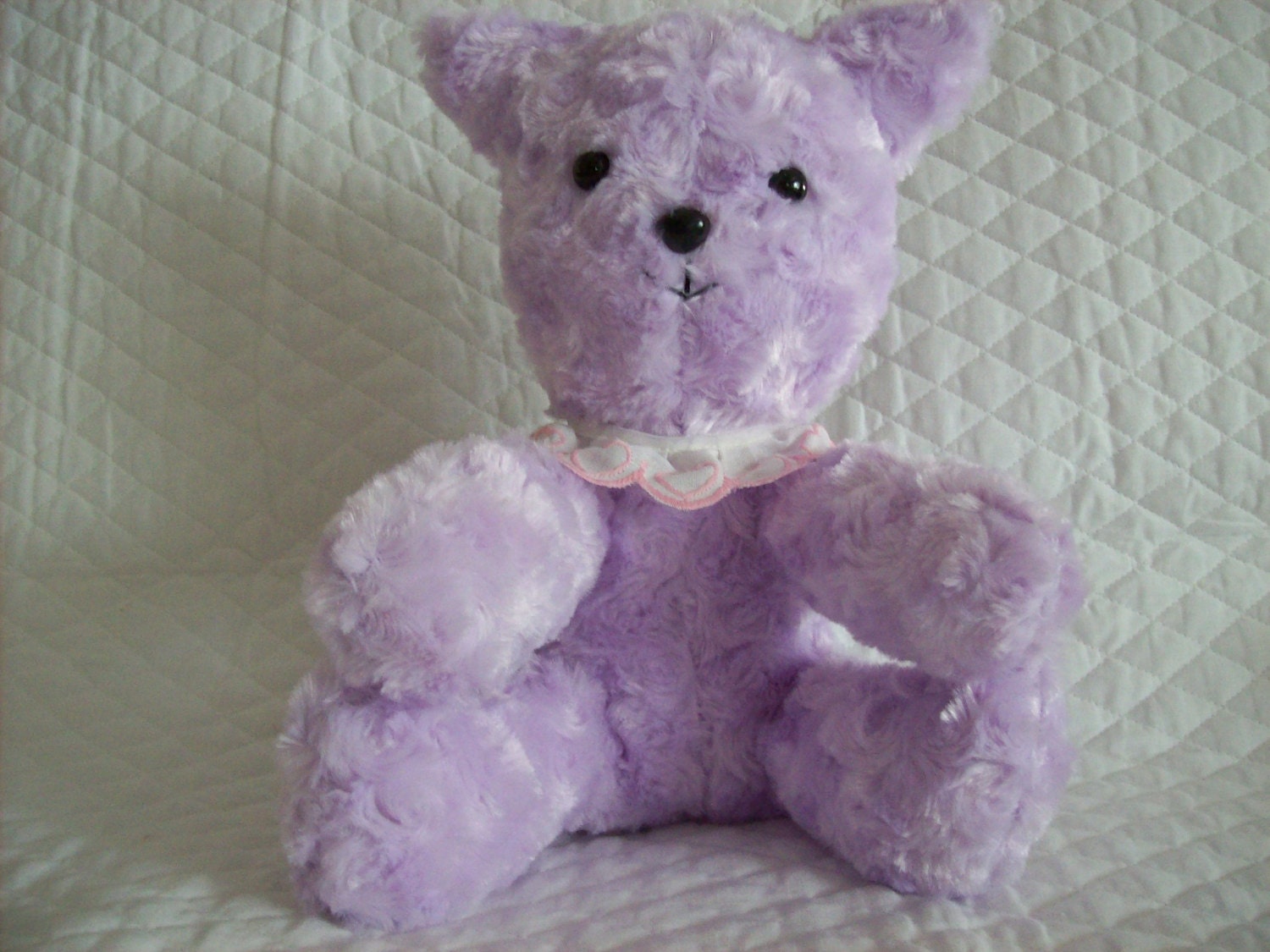 purple stuffed animal cat