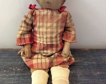 Antique cloth doll with drawn features
