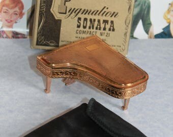 Sonata Grand Piano Compact Mirror By Pygmalion of England. In original box with carry pouch, sifter and powder puff. Rare and Hard To Find