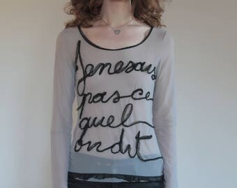 90's Gaultier sheer mesh club kid French 'I'm not what they say I am" shirt