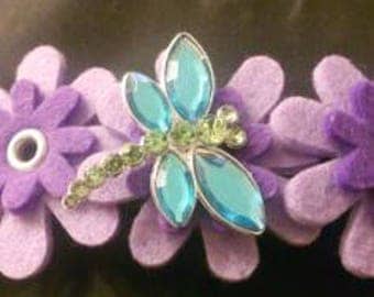 Hairpin purple flowers with dragonfly