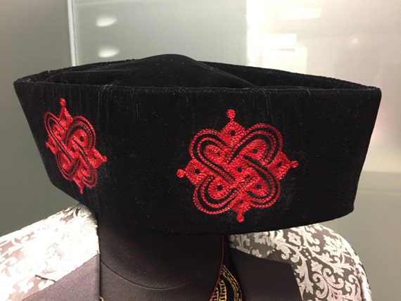 Black Velvet hat. Red embroidery 23 inches round.