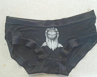 Flower with teeth printed on satin panties.