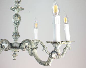 Brass light fixture, chandelier. Shabby chic lighting. Light green-gray chandelier.