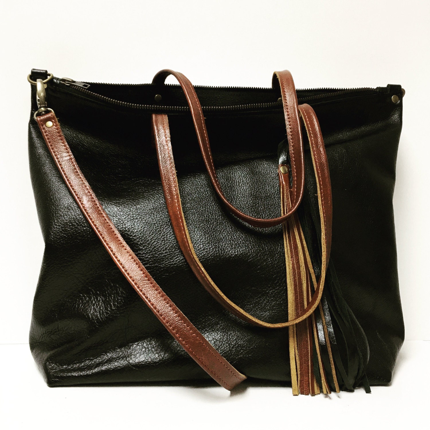 Black and brown leather tote bag with cross body strap