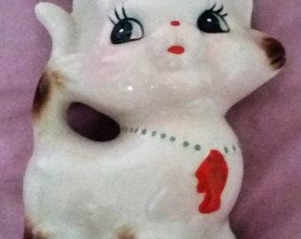 Porcelain cat piggy bank