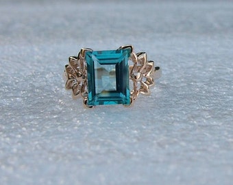 Gold and Blue Topaz ring. Genuine baguette-shaped blue Topaz set in 9 carat yellow gold.