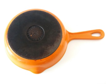 La Creuset enameled cast iron skillet, saute pan in flame orange