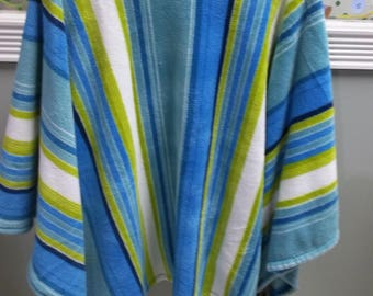 Blue green and white striped fleece poncho. Home made by Pam. in my smoke and pet free shop