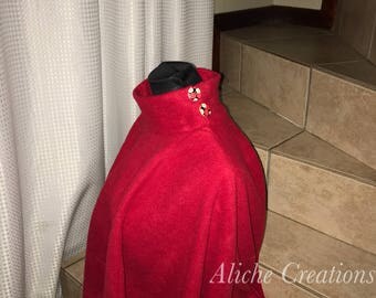 Red poncho with neck and side slits with buttons