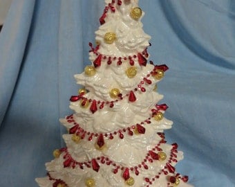 White Christmas tree, decorated with red