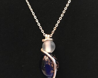 Sterling silver necklace with sculptured glass beaded pendant