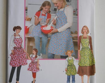 Mother and Daughter Full Apron Pattern Simplicity 3949 Size 3 4 5 6 7 8 10 12 14 16 18 20 Bust 22 23 24 25 26 27 32 1/2 34 36 38 40 42 UNCUT