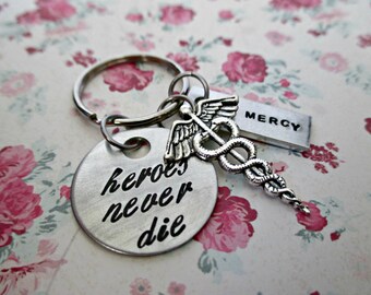 heroes never die - hand stamped overwatch mercy inspired keychain with caduceus charm