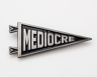 Mediocre enamel pin. Pennant lapel pin. Antique silver and black accessory.