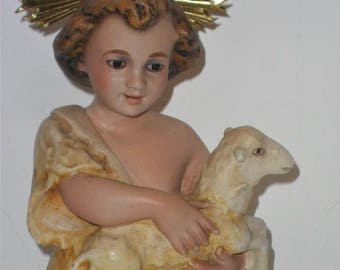 Antique child Jesus with the Lamb with glass eyes . Olot religious figure of the 50s