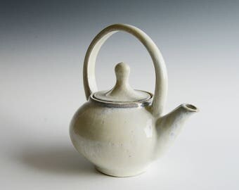 Handthrown teapot in buff stoneware