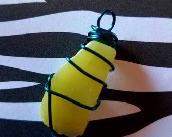 Cool yellow quartz stone, handwrapped in a turquoise copper wire.