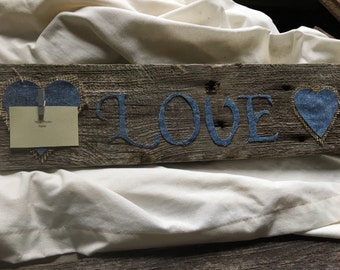 Barn wood sign with "Love" in denim letters & 2 denim hearts