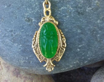 Vintage 1928 brand emerald colored beetle necklace
