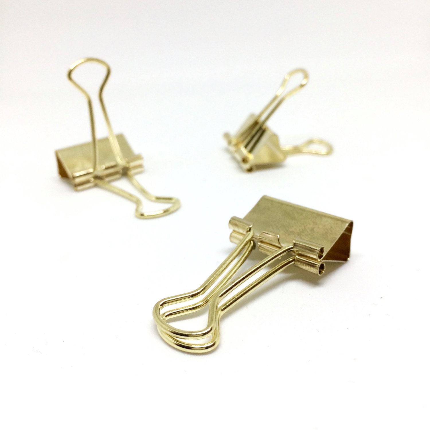 Gold coloured solid bulldog paper clips