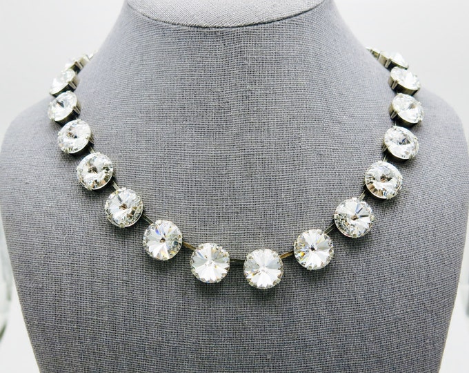 Luxurious 14mm genuine Swarovski crystal rivoli stones set in a timeless collar necklace. Anna Wintour style large crystal necklace.