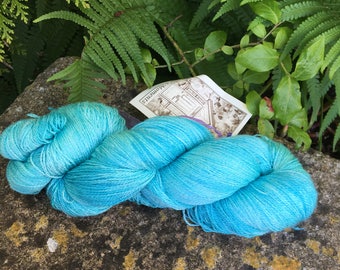 95 gms hand painted merino /silk lace weight yarn." Aqua seas