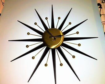 Black and Brass ATOMIC STARBURST CLOCK key wind mid century modern all metal construction 1950