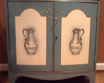 Maddox NY Colonial Reproduction Wood Cabinet with Blue, Cream and Gold Hand Painted