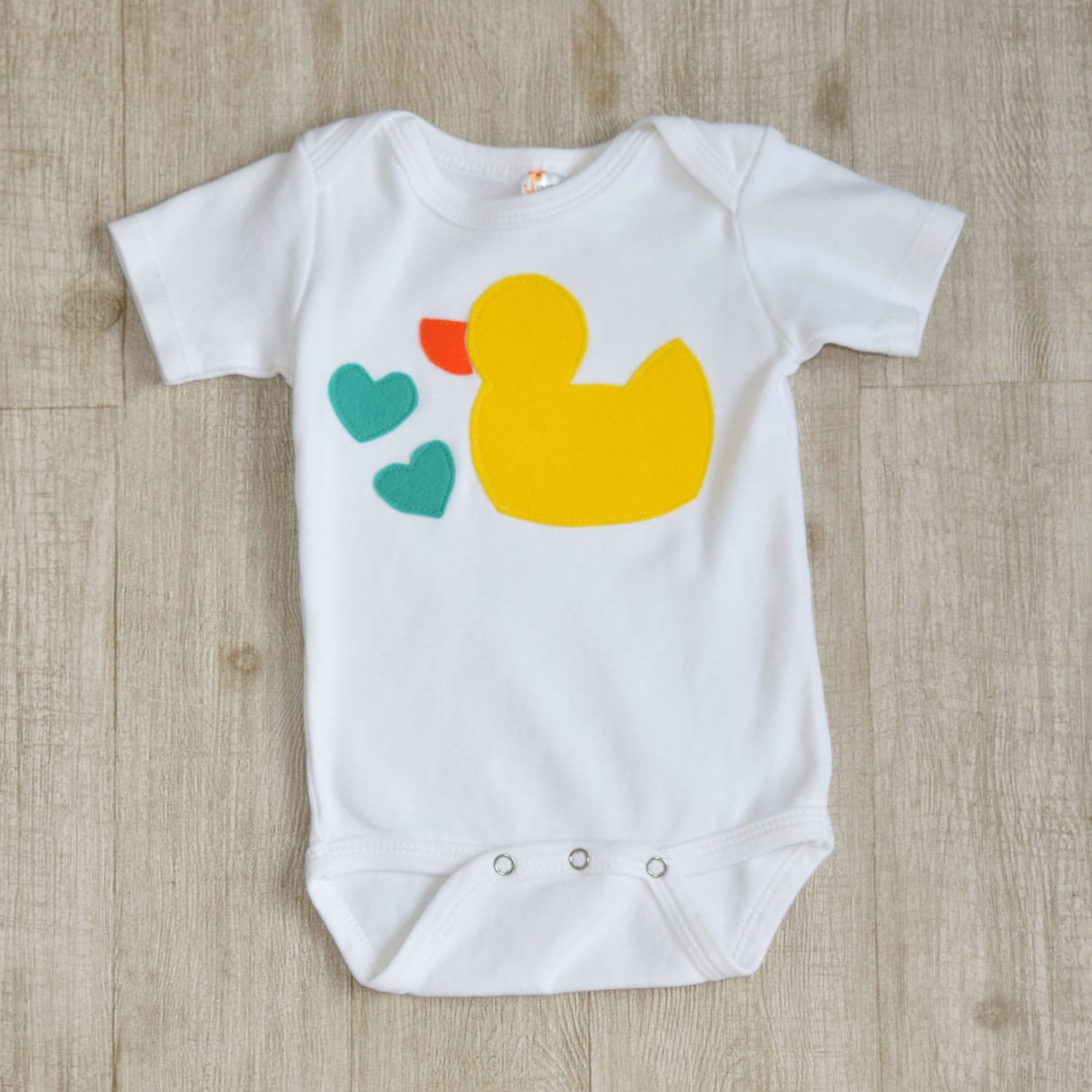 Baby onesie with yellow duck felt applique