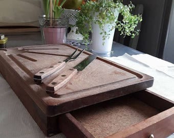 Old cutting board with vintage wooden drawer