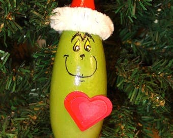 Hand painted banana gourd grinch Christmas ornament with wooden heart embellishment by Debbie Easley 13