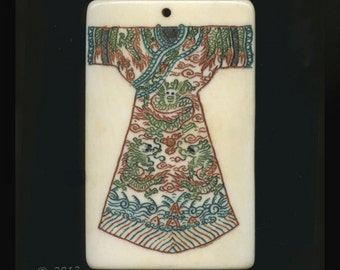 Polychrome scrimshaw ox-bone pendant with dragon robe design 48x30mm. Sold individually. B3-bo171(e)