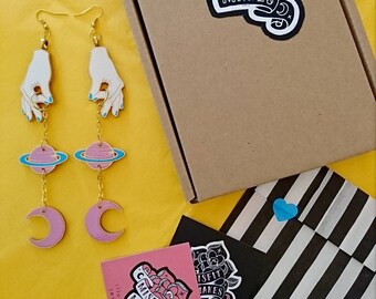 Space Earrings. Galaxy Earrings. Planet and Moon Earrings. Hand Earrings. Moon Earrings. Long Earrings. Laser Cut Earrings. Holding the sky.