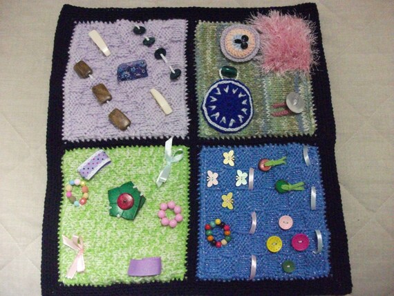 Knitted twiddle sensory lap blanket for dementia