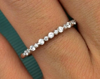 SPECIAL SETTING WEDDING band with alternative big and small simulated diamonds set in single prong set, 14 karat white gold wedding band