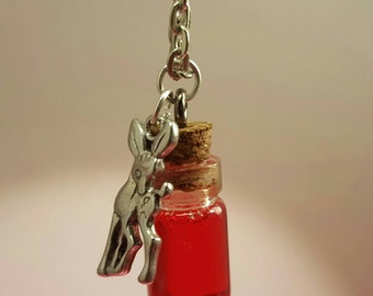 Glass vials with deer pendant on silver chain