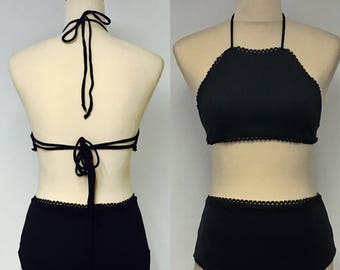 Black Bikini Bathing Suit with Halter Neck and Ties at back. High Waisted Pants with frill detail.