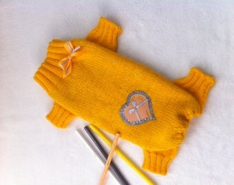 Yellow knitted coat for a dog or a cat