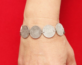 Bracelet of coins. Coins Austria. Coins with the eagle.