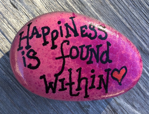 Happiness is found within. Painted rock.