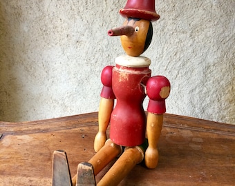 Wood handmade jointed Pinocchio doll with rubber nose | 1950s
