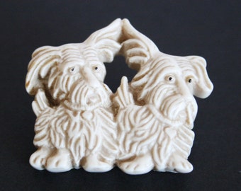 Vintage plastic dog brooch. 2 dog brooch