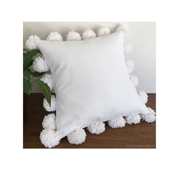 white decorative pillow