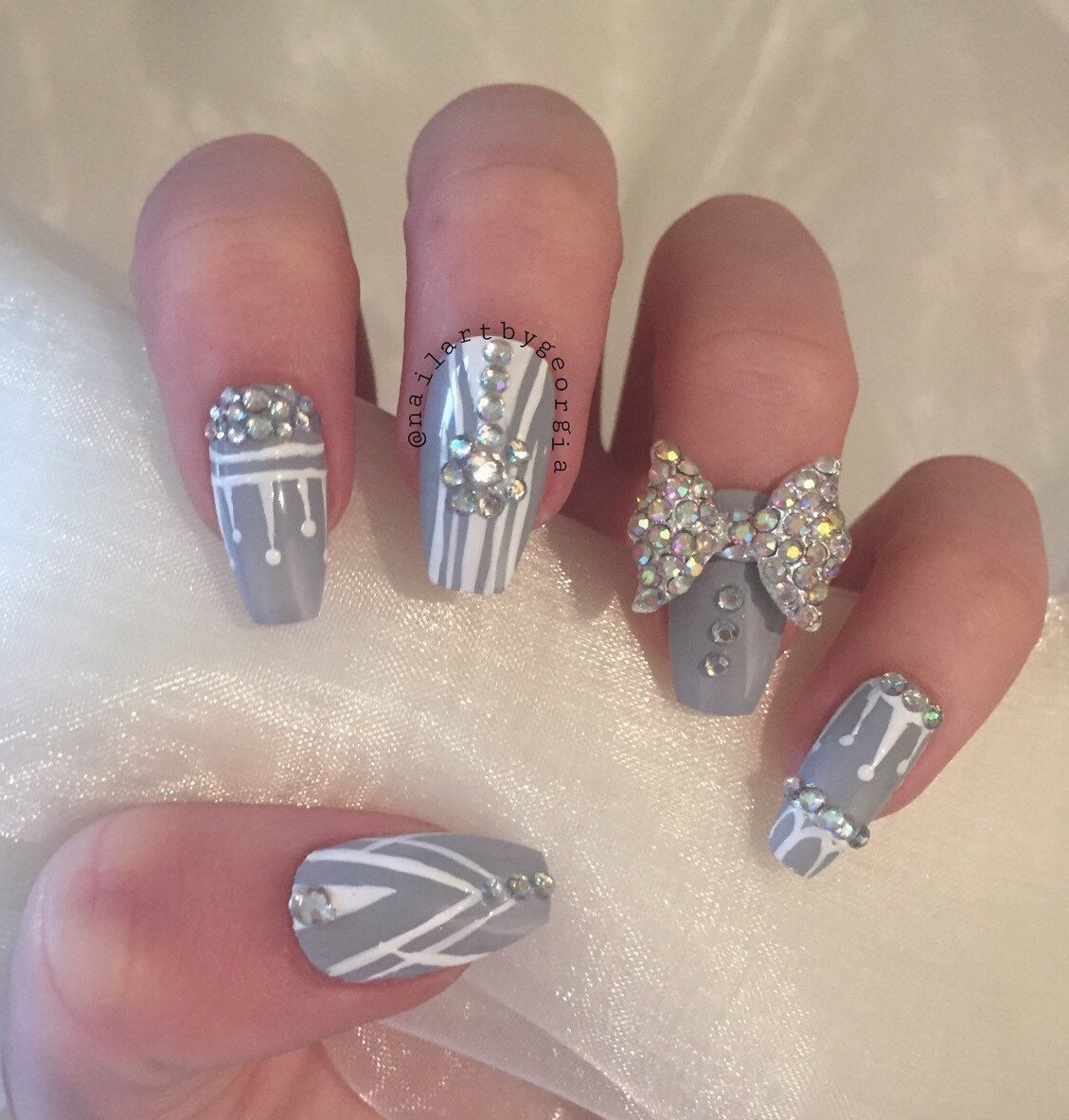 Grey and white coffin false nails with rhinestones and 3d