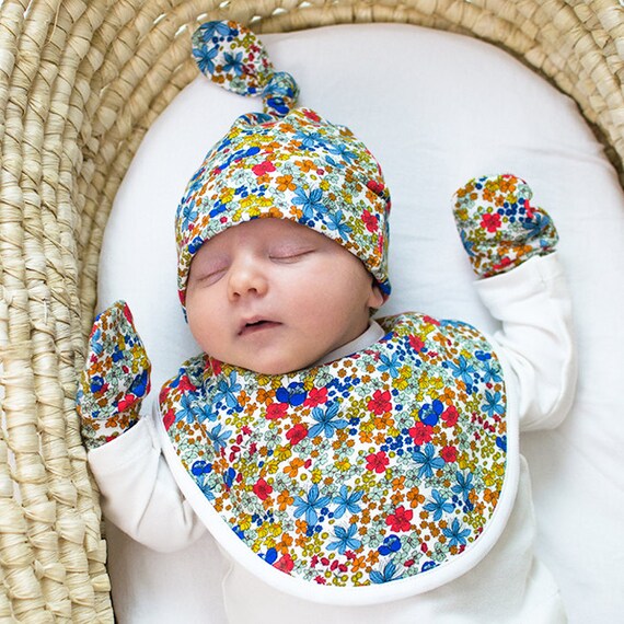 Baby dribble bib featuring Tropical Flowers pattern. Newborn