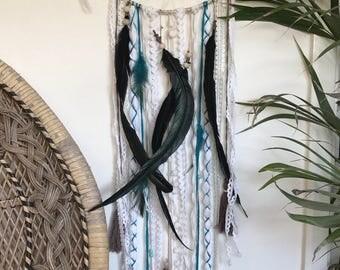 Boho indian style dreamcatcher with black rooster feathers
