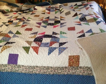 Beautiful Homemade over queen size quilt. One is queen size 88x100. It's 200.00