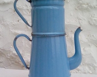 A vintage enamelware coffee pot, cafetière, blue.