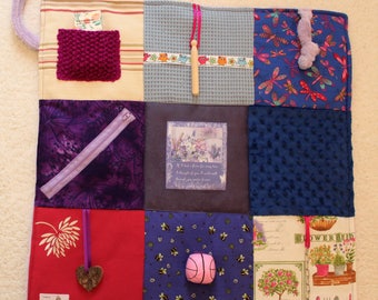 Bespoke fidget blanket for people with Alzheimer's disease or dementia . Busy blanket in shades of lavender. Customize with your own photos.